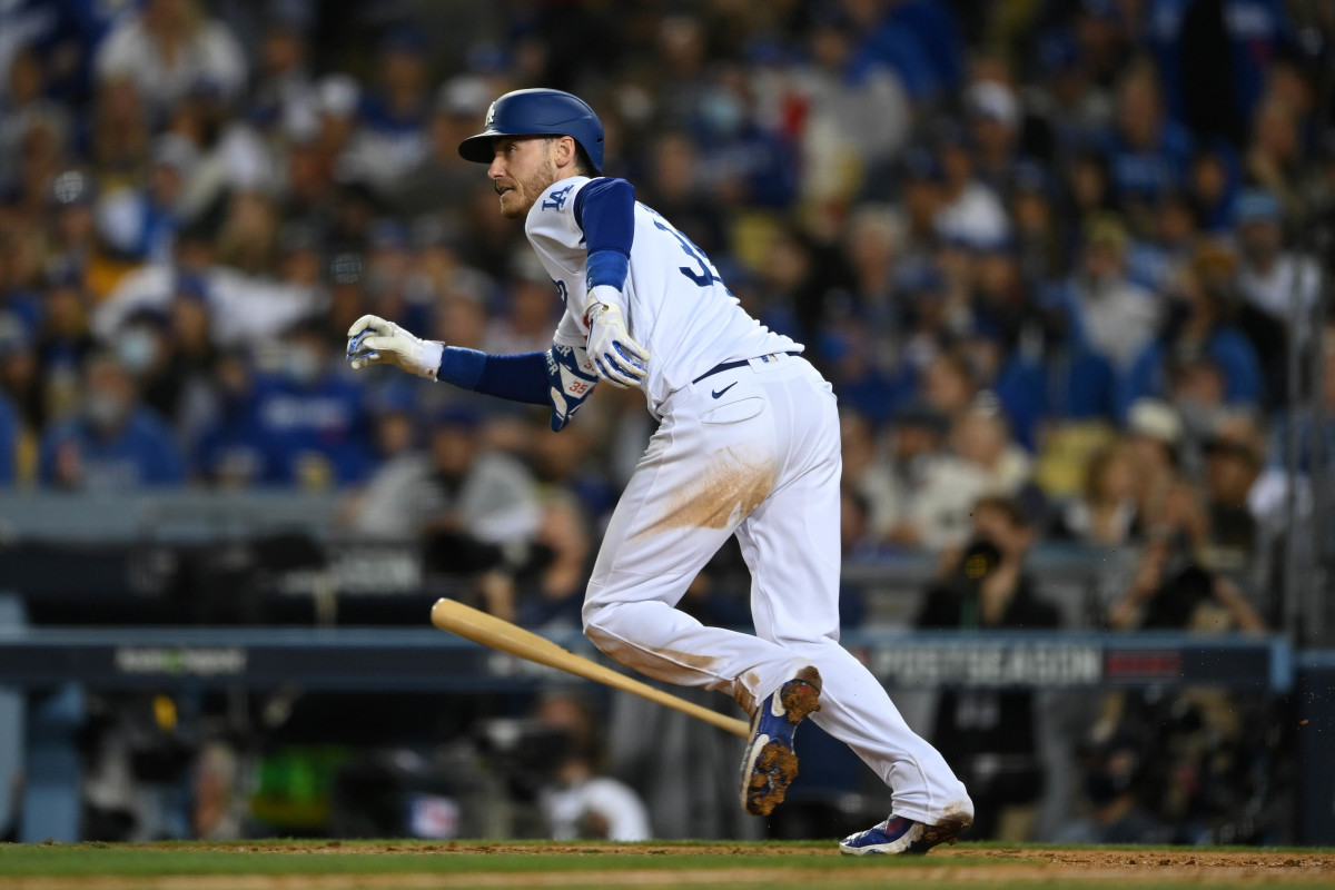 Oct 21, 2021; Los Angeles, California, USA; Los Angeles Dodgers first baseman Cody Bellinger (35) hits a single in the seventh inning against the Atlanta Braves during game five of the 2021 NLCS at Dodger Stadium. Mandatory Credit: Jayne Kamin-Oncea-USA TODAY Sports