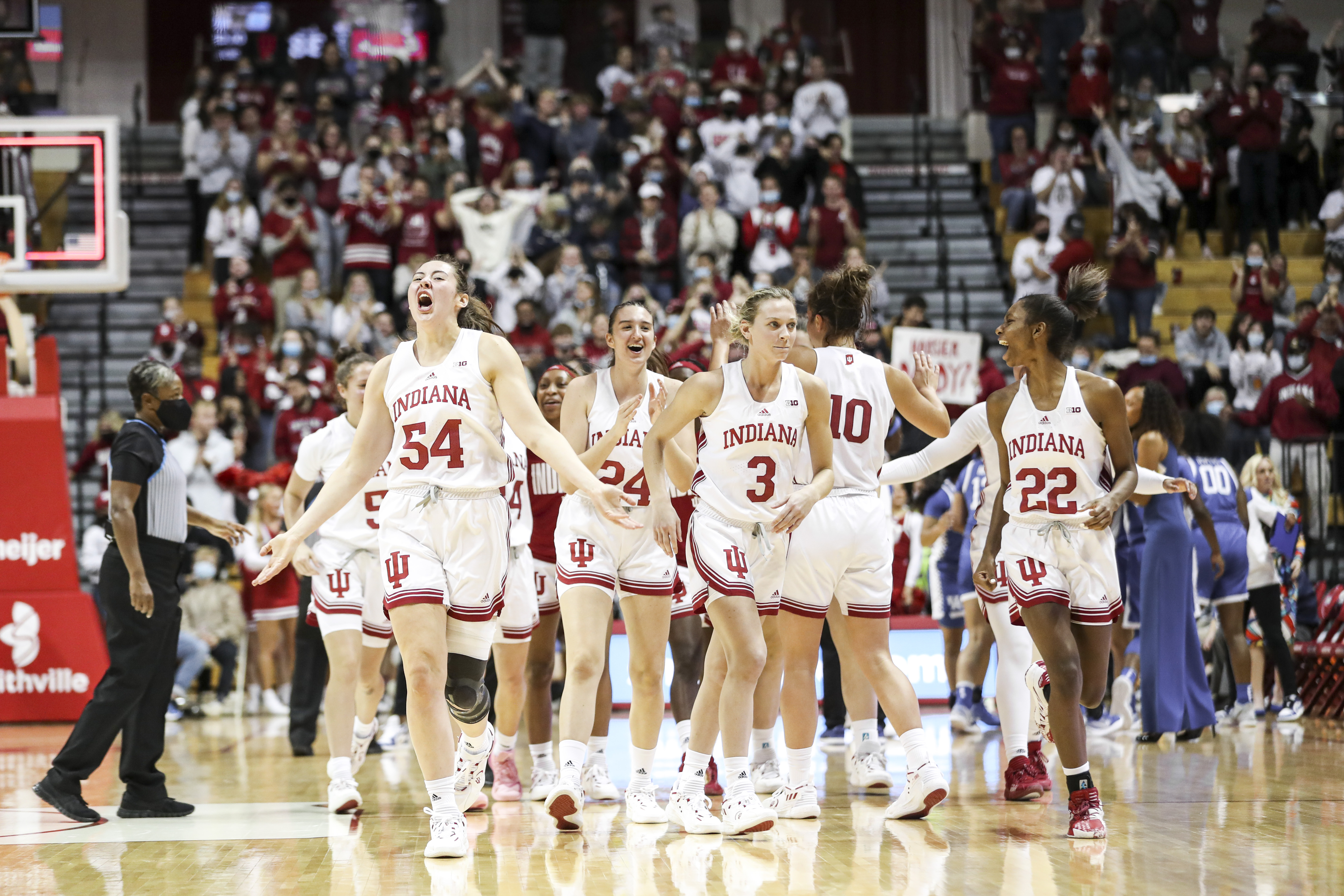 Mackenzie Holmes heads to the court followed by her teammates at Indiana's home game versus Kentucky.