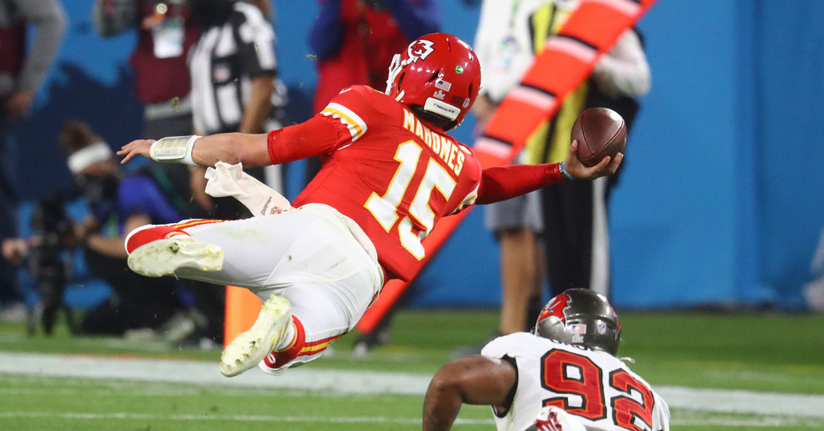 Feb 7, 2021; Tampa, FL, USA; Kansas City Chiefs quarterback Patrick Mahomes (15) throws a sidearm pass in the air against Tampa Bay Buccaneers defensive end William Gholston (92) during the fourth quarter in Super Bowl LV at Raymond James Stadium. Mandatory Credit: Mark J. Rebilas-USA TODAY Sports