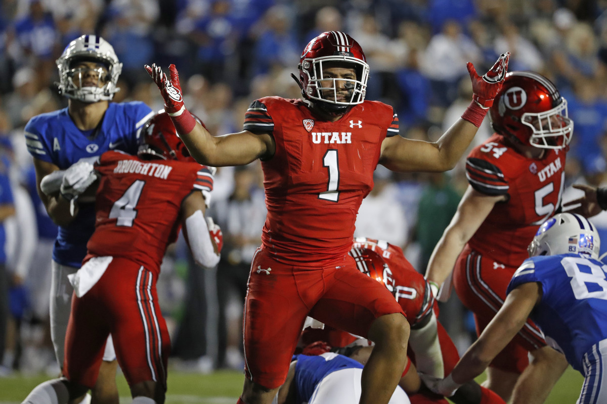Utah Utes linebacker Nephi Sewell (1) reacts after a stop against the Brigham Young Cougars.