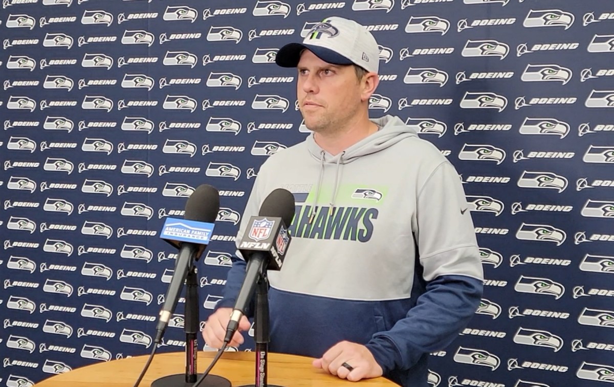 Seahawks offensive coordinator Shane Waldron fields questions from reporters during preparation for a home contest with the Cardinals.