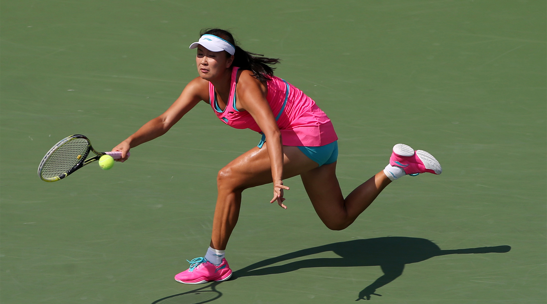 Sep 5, 2014; New York, NY, USA; Peng Shuai (CHN) returns a shot to Caroline Wozniacki (DEN) on day twelve of the 2014 U.S. Open tennis tournament at USTA Billie Jean King National Tennis Center.