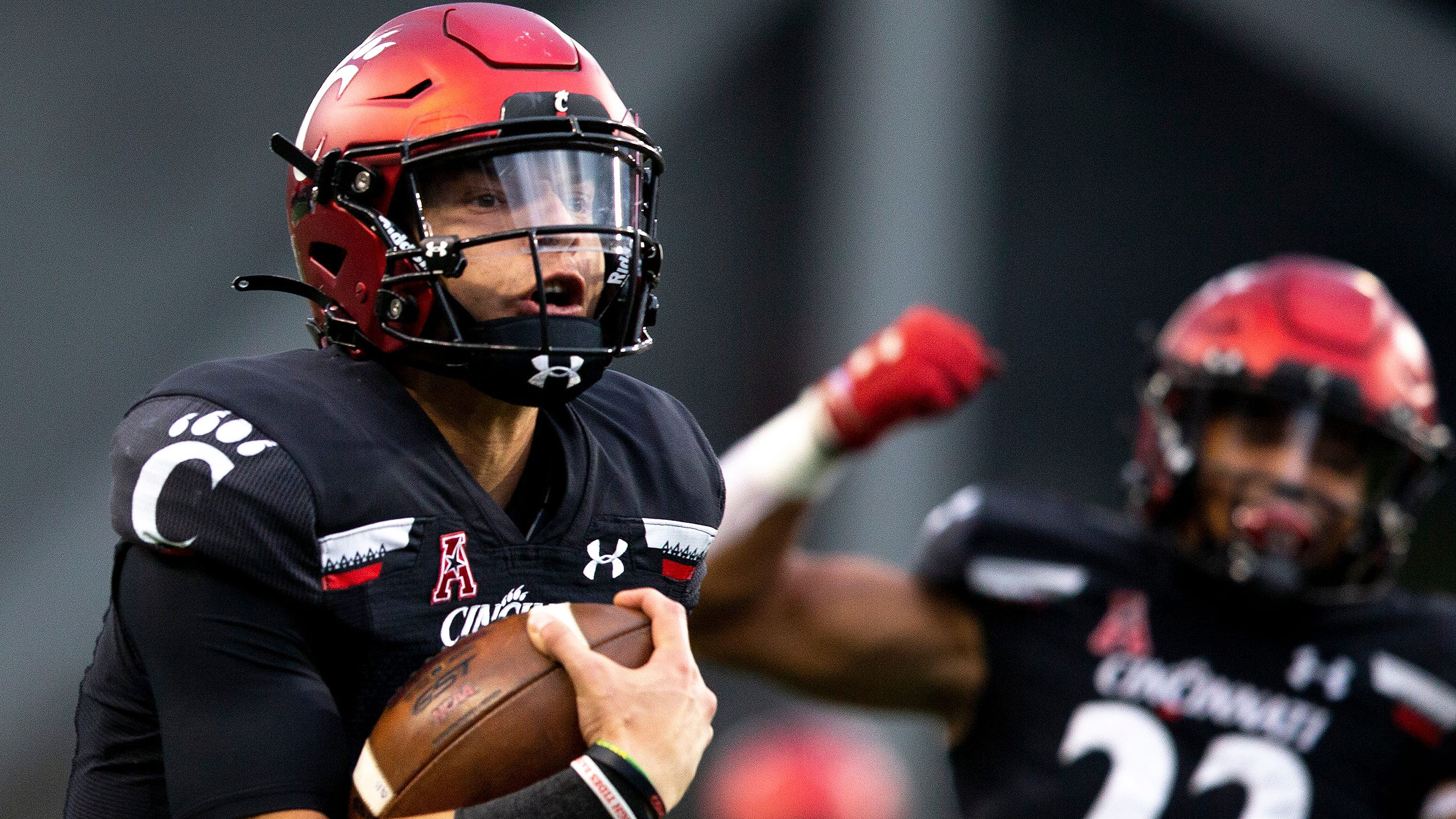 Cincinnati QB Desmond Ridder runs with the ball