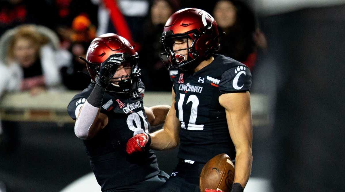 Cincinnati Bearcats wide receiver Alec Pierce (12) celebrates with Cincinnati Bearcats tight end Josh Whyle (81) after scoring a touchdown in the second half of the NCAA football game on Saturday, Nov...