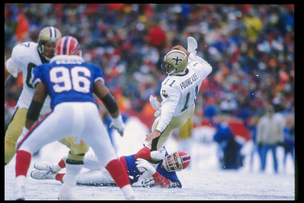 Saints QB John Fourcade is pressured as he throws against the Bills in 1989. Credit: USA TODAY 