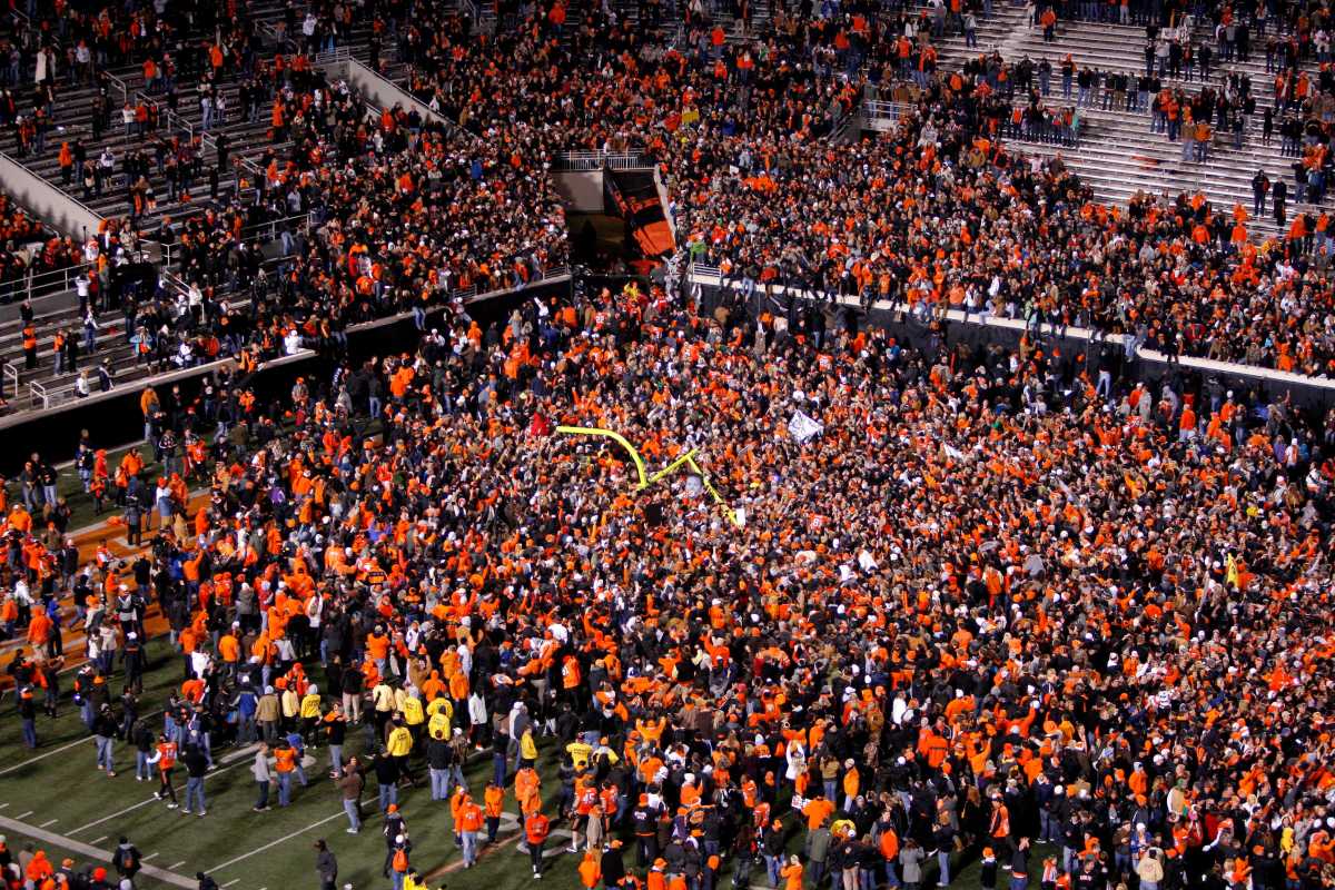 Oklahoma State fans celebrate following the Bedlam college football game between the Oklahoma State University Cowboys (OSU) and the University of Oklahoma Sooners (OU) at Boone Pickens Stadium in Stillwater, Okla., Saturday, Dec. 3, 2011. Osu076