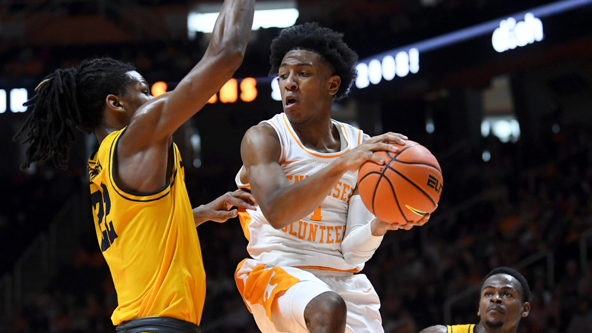 Tennessee guard Kennedy Chandler (1) is guarded by ETSU forward Jaden Seymour (22) in the NCAA college basketball game between the Tennessee Volunteers and the ETSU Buccaneers.