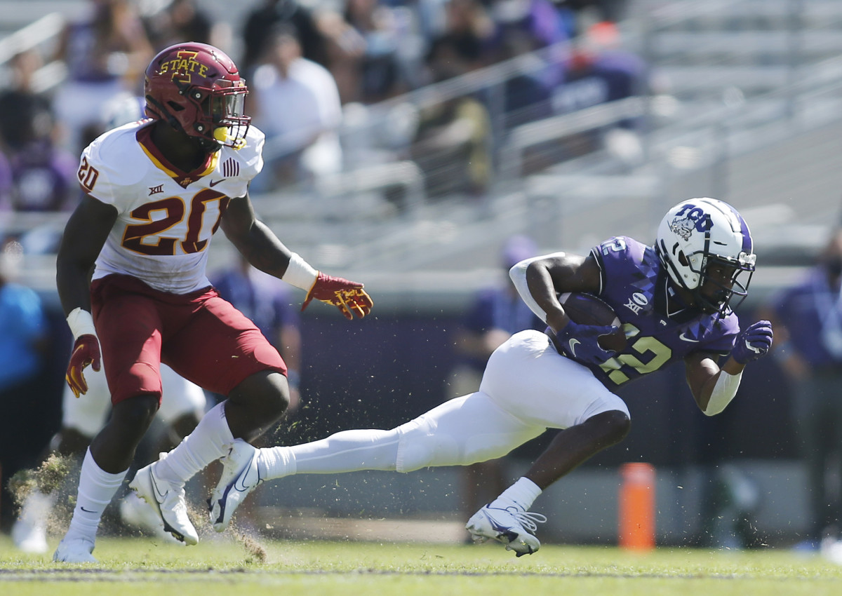 Sep 26, 2020; Fort Worth, Texas, USA; TCU Horned Frogs wide receiver Derius Davis (12) runs the ball against Iowa State Cyclones linebacker Aric Horne (20) in the third quarter at Amon G. Carter Stadium. M