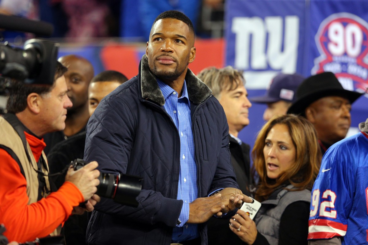 Nov 3, 2014; East Rutherford, NJ, USA; New York Giants former defensive end Michael Strahan on the sidelines before a game against the Indianapolis Colts at MetLife Stadium.