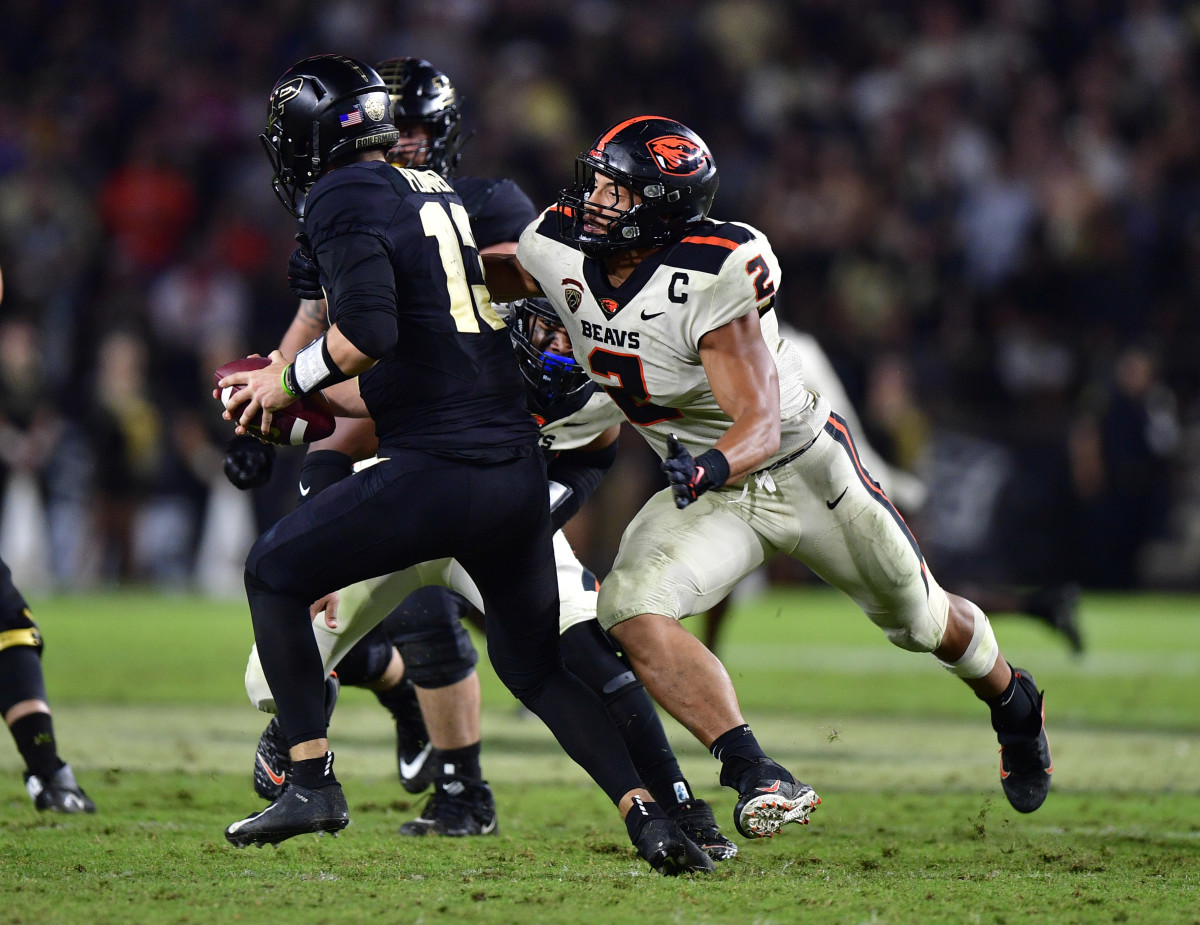 Oregon State linebacker Andrzej Hughes-Murray (2) sacks Purdue quarterback Aidan O'Connell (13).