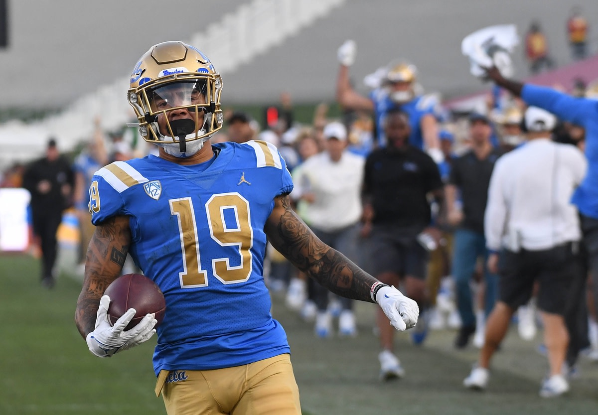 Nov 20, 2021; Los Angeles, California, USA; UCLA Bruins running back Kazmeir Allen (19) returns a kick for a touchdown against the Southern California Trojans in the second half at the Los Angeles Memorial Coliseum. Mandatory Credit: Richard Mackson-USA TODAY Sports