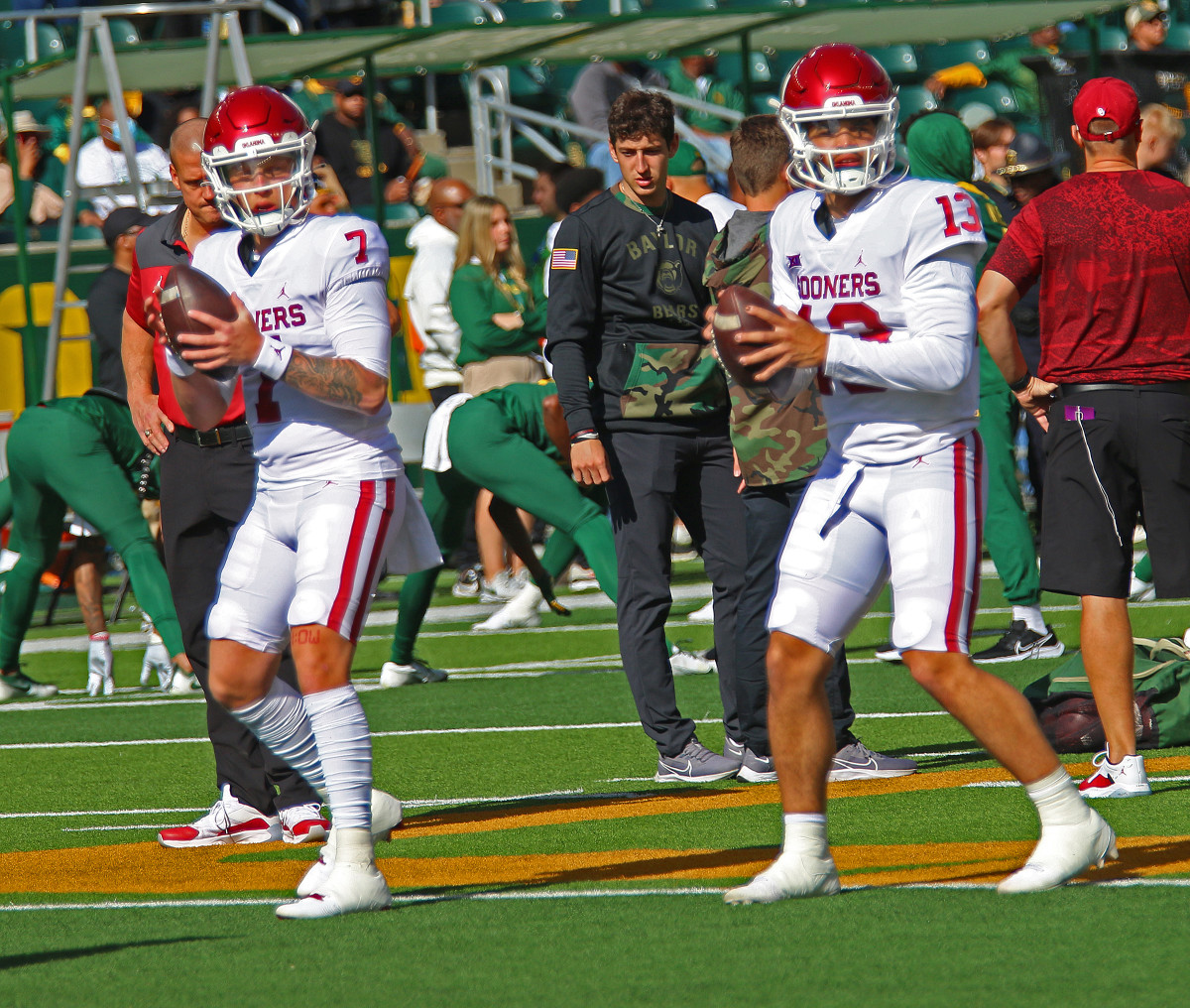 Spencer Rattler (left) and Caleb Williams warm up ahead of the Baylor game