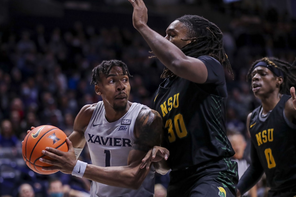 Nov 21, 2021; Cincinnati, Ohio, USA; Xavier Musketeers guard Paul Scruggs (1) drives to the basket against Norfolk State Spartans forward Kris Bankston (30) in the first half at Cintas Center. Mandatory Credit: Katie Stratman-USA TODAY Sports