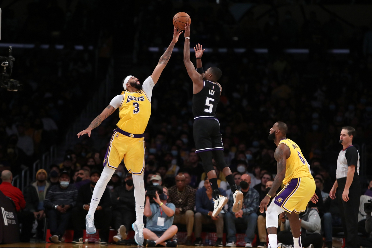 Nov 26, 2021; Los Angeles, California, USA; Los Angeles Lakers forward Anthony Davis (3) blocks a shot by Sacramento Kings guard De'Aaron Fox (5) during the second overtime at Staples Center. The Kings won 141-137 in triple-overtime. Mandatory Credit: Kiyoshi Mio-USA TODAY Sports