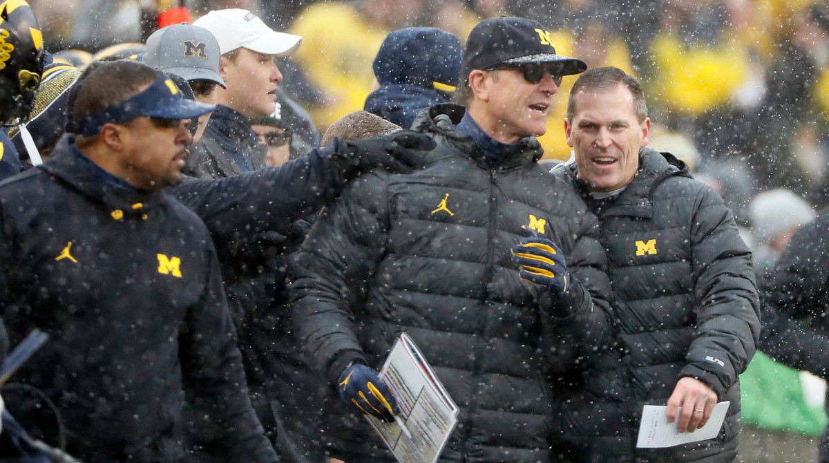 Michigan Wolverines head coach Jim Harbaugh celebrates on the sideline after beating Ohio State Buckeyes 42-27 in a NCAA College football at Michigan Stadium at Ann Arbor, Mi on November 27, 2021. Osu21um Kwr 34