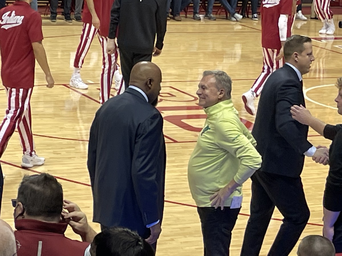 Indiana coach Mike Woodson (left) visits with Marshall coach Dan D'Antoni prior to tipoff. Woodson coached for his brother, Mike D'Antoni, with the New York Knicks in the NBA.