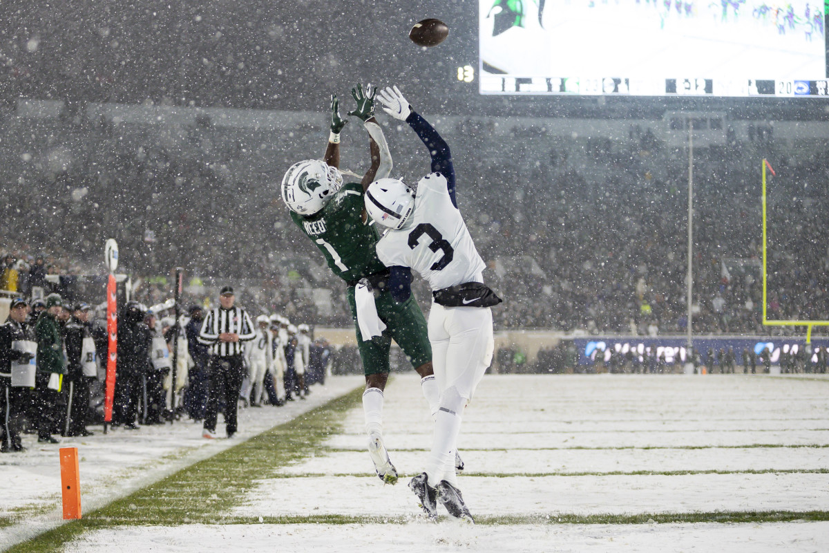 Michigan State's Jayden Reed catches a touchdown pass against Penn State's Johnny Dixon. (Raj Mehta/USA Today Sports)