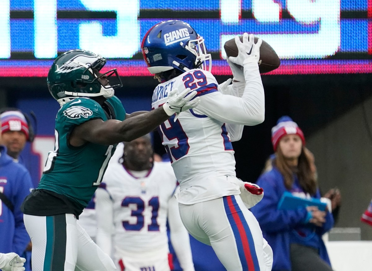 Nov 28, 2021; East Rutherford, NJ, USA; New York Giants free safety Xavier McKinney (29) intercepts a pass intended for Philadelphia Eagles wide receiver Jalen Reagor (18) at MetLife Stadium. Mandatory Credit: Robert Deutsch-USA TODAY Sports