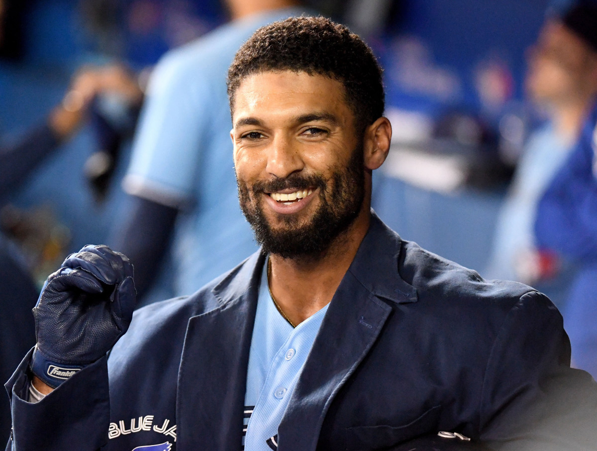Marcus Semien smiles in the Blue Jays dugout