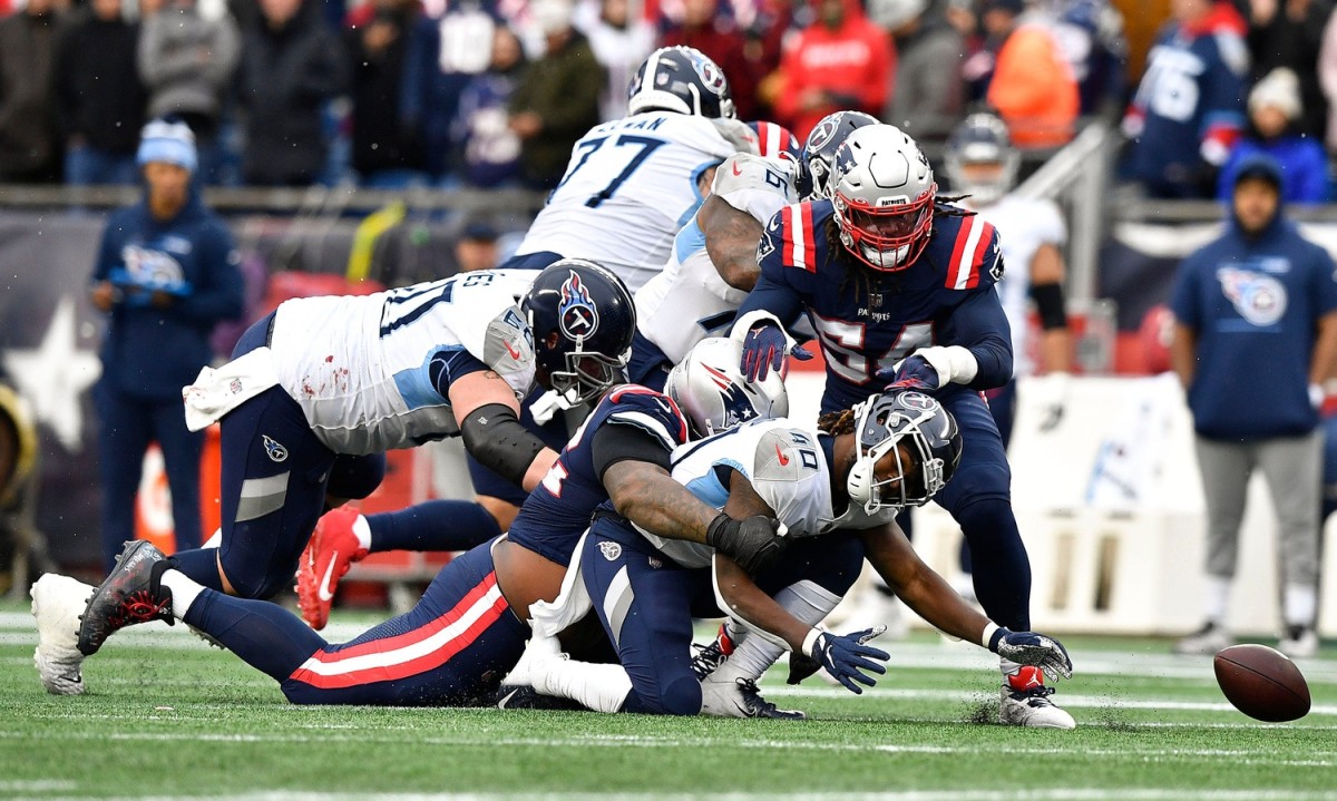 Tennessee Titans running back Dontrell Hilliard (40) fumbles the ball during the second quarter at Gillette Stadium Sunday, Nov. 28, 2021 in Foxborough, Mass.