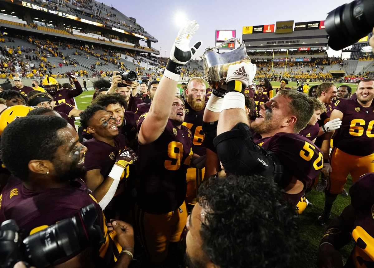 Arizona State Sun Devils offensive lineman Jarrett Bell (50) celebrates with his teammates after defeating the Arizona Wildcats during the 95th Territorial Cup game.