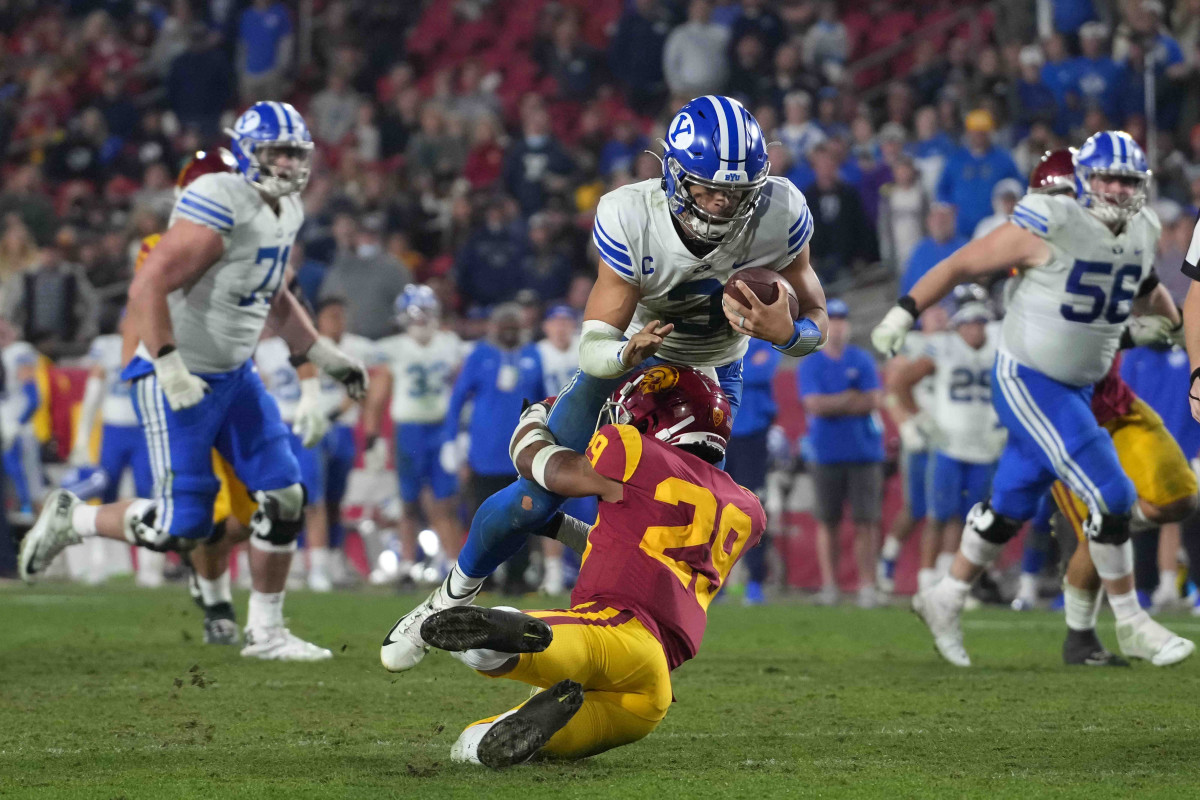 BYU Cougars quarterback Jaren Hall (3) is tackled by Southern California Trojans safety Xavion Alford (29).