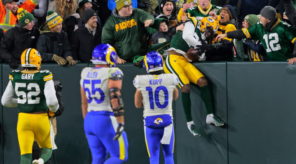 Green Bay Packers cornerback Rasul Douglas (29) celebrates with fans after intercepting the ball against the Los Angeles Rams in the third quarter during their football game Sunday, November 28, 2021, at Lambeau Field in Green Bay, Wis.