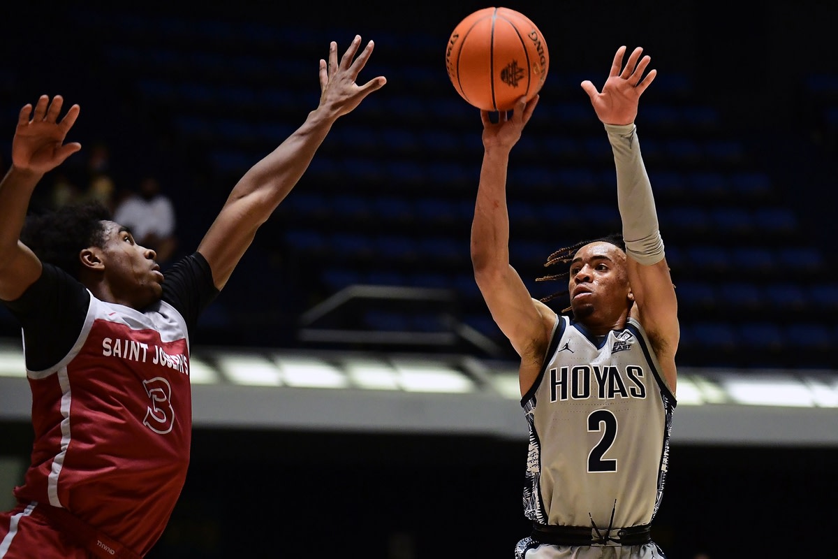 Nov 26, 2021; Anaheim, CA, USA; Georgetown Hoyas guard Dante Harris (2) shoots against Saint Josephs Hawks guard Cameron Brown (3) during the second half of the Wooden Legacy at Anaheim Arena. Mandatory Credit: Gary A. Vasquez-USA TODAY Sports