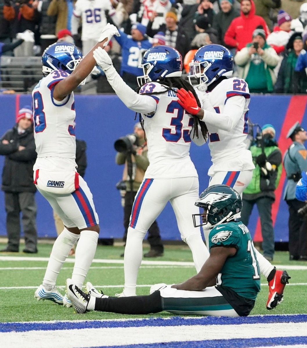 Jalen Reagor sits dejectedly after letting a pass slip through his hands to end the Eagles' loss to the Giants