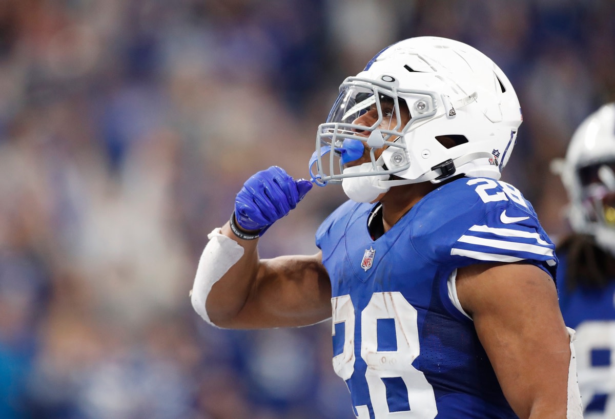 Indianapolis Colts running back Jonathan Taylor (28) celebrates after a fourth quarter touchdown Sunday, Nov. 28, 2021, during a game against the Tampa Bay Buccaneers at Lucas Oil Stadium in Indianapolis.