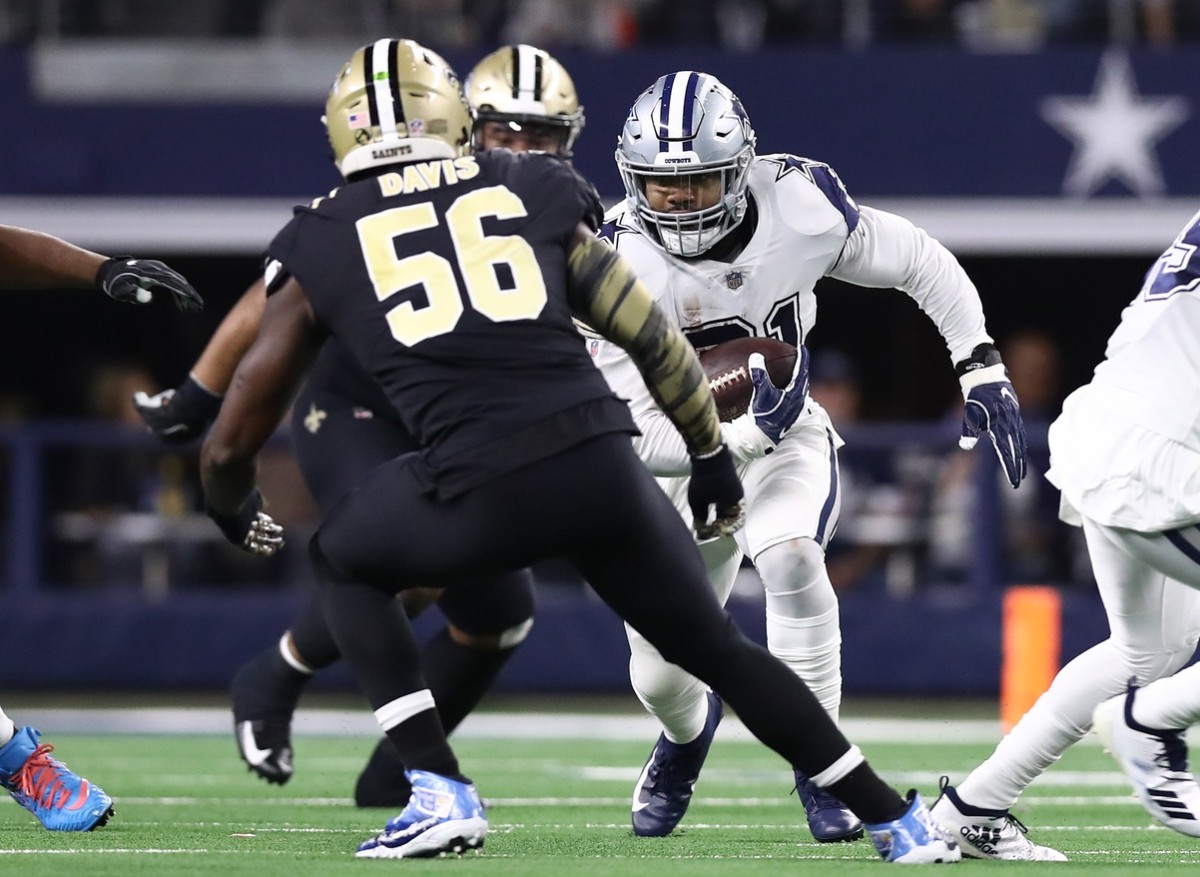 Dallas Cowboys running back Ezekiel Elliott (21) versus New Orleans Saints linebacker Demario Davis (56) in the open field. Mandatory Credit: Matthew Emmons-USA TODAY