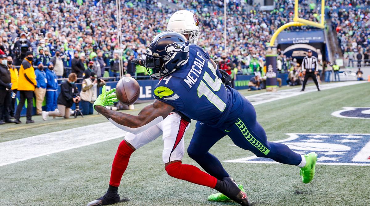 Nov 21, 2021; Seattle, Washington, USA; Seattle Seahawks wide receiver DK Metcalf (14) drops a potential touchdown pass against the Arizona Cardinals during the second quarter at Lumen Field.