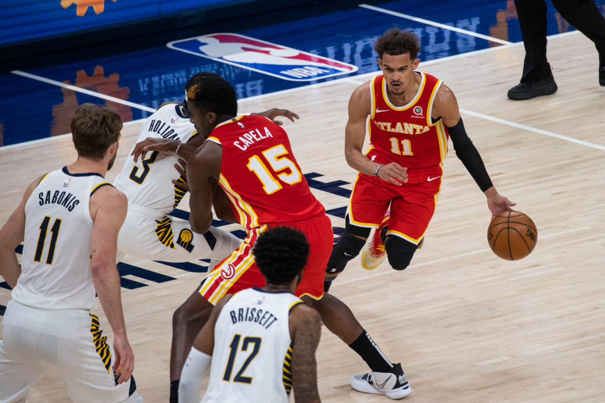 Atlanta Hawks guard Trae Young (11) dribbles the ball in the third quarter against the Indiana Pacers at Bankers Life Fieldhouse.