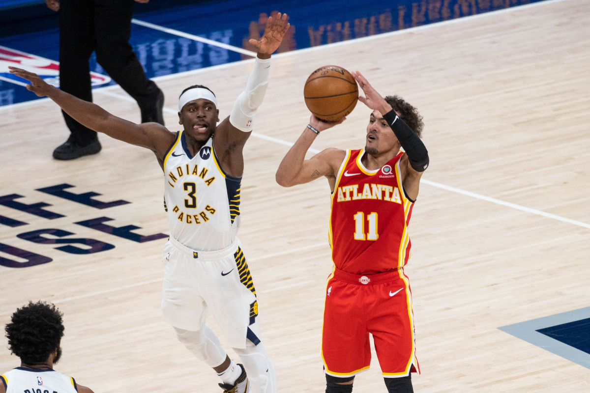 Atlanta Hawks guard Trae Young (11) shoots the ball while Indiana Pacers guard Aaron Holiday (3) defends in the third quarter at Bankers Life Fieldhouse.