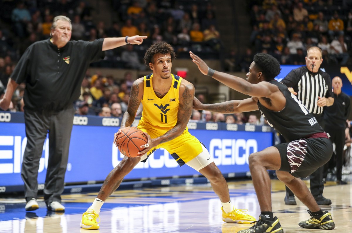 Nov 26, 2021; Morgantown, West Virginia, USA; West Virginia Mountaineers forward Jalen Bridges (11) looks to pass during the second half against the Eastern Kentucky Colonels at WVU Coliseum.