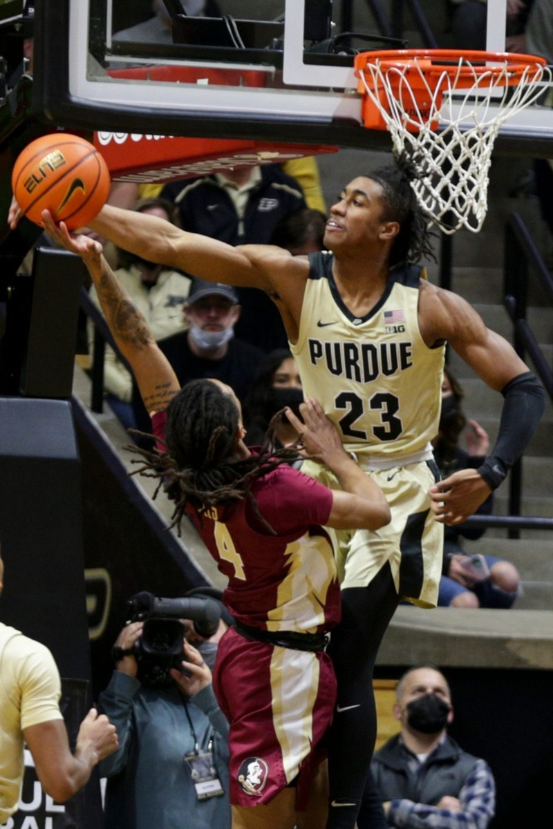 Purdue guard Jaden Ivey (23) blocks Florida State guard Caleb Mills (4)'s layup during the first half. (Nikos Frazier/USA TODAY NETWORK)