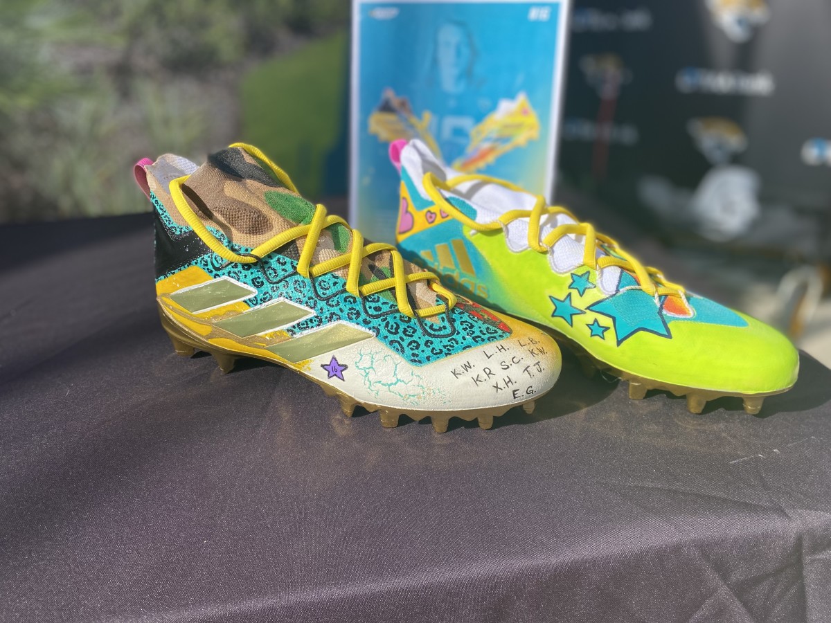 Trevor Lawrence's cleats, which contain the initials of some of the students who designed them.