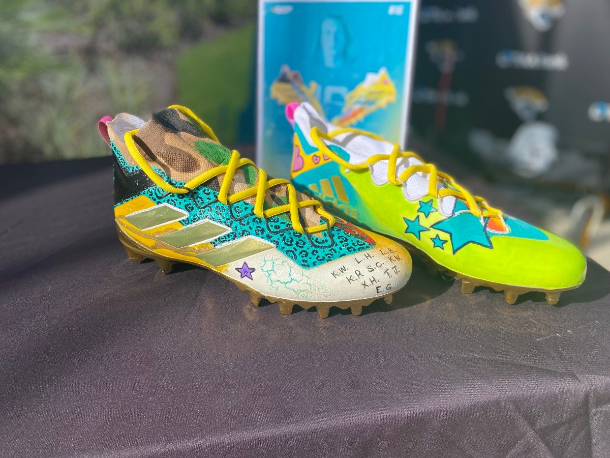 Trevor Lawrence's cleats, which contain the initials of some of the students who designed them.