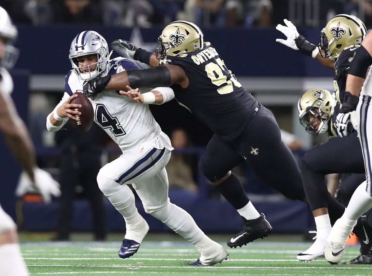 Dallas Cowboys quarterback Dak Prescott (4) is sacked by New Orleans Saints defensive tackle David Onyemata (93). Mandatory Credit: Matthew Emmons-USA TODAY Sports