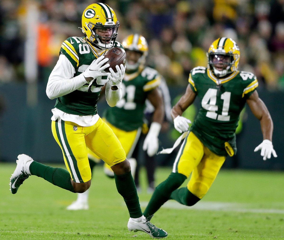 Green Bay Packers cornerback Rasul Douglas (29) intercepts a pass in the second half against the Los Angeles Rams during their football game on Sunday November 28, 2021, at Lambeau Field in Green Bay, Wis.