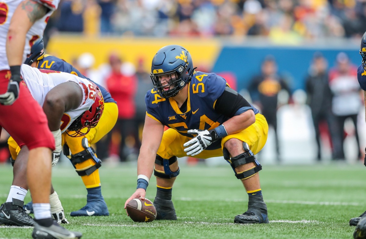 Oct 30, 2021; Morgantown, West Virginia, USA; West Virginia Mountaineers offensive lineman Zach Frazier (54) before a snap during the second quarter against the Iowa State Cyclones at Mountaineer Field at Milan Puskar Stadium.