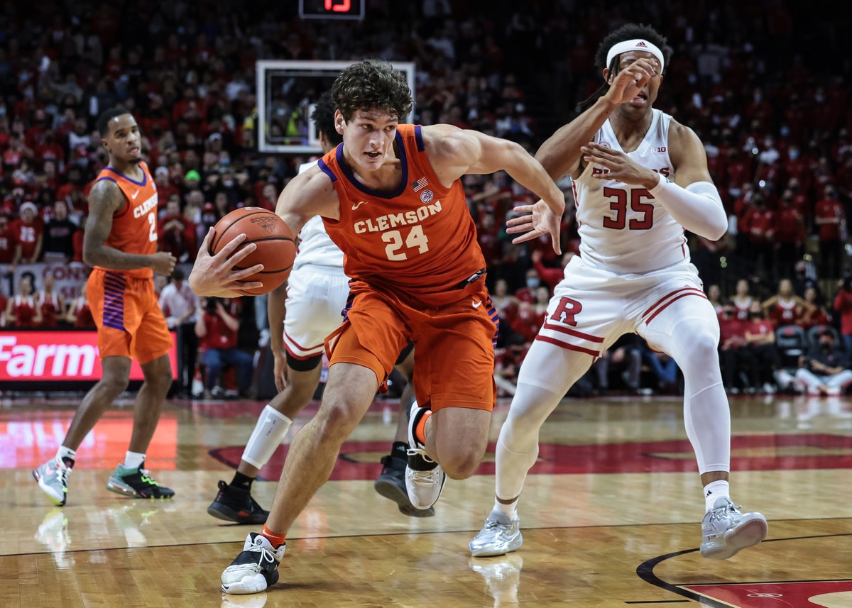 Nov 30, 2021; Piscataway, New Jersey, USA; Clemson Tigers forward PJ Hall (24) drives to the basket as Rutgers Scarlet Knights forward Ralph Gonzales-Agee (35) defends during the first half at Jersey Mike's Arena. Mandatory Credit: Vincent Carchietta-USA TODAY Sports