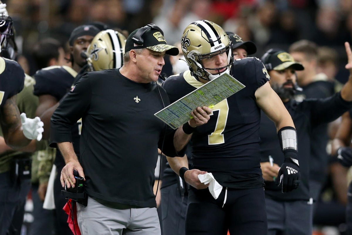 New Orleans Saints head coach Sean Payton talks to Taysom Hill (7) against the Atlanta Falcons. Mandatory Credit: Chuck Cook-USA TODAY Sports