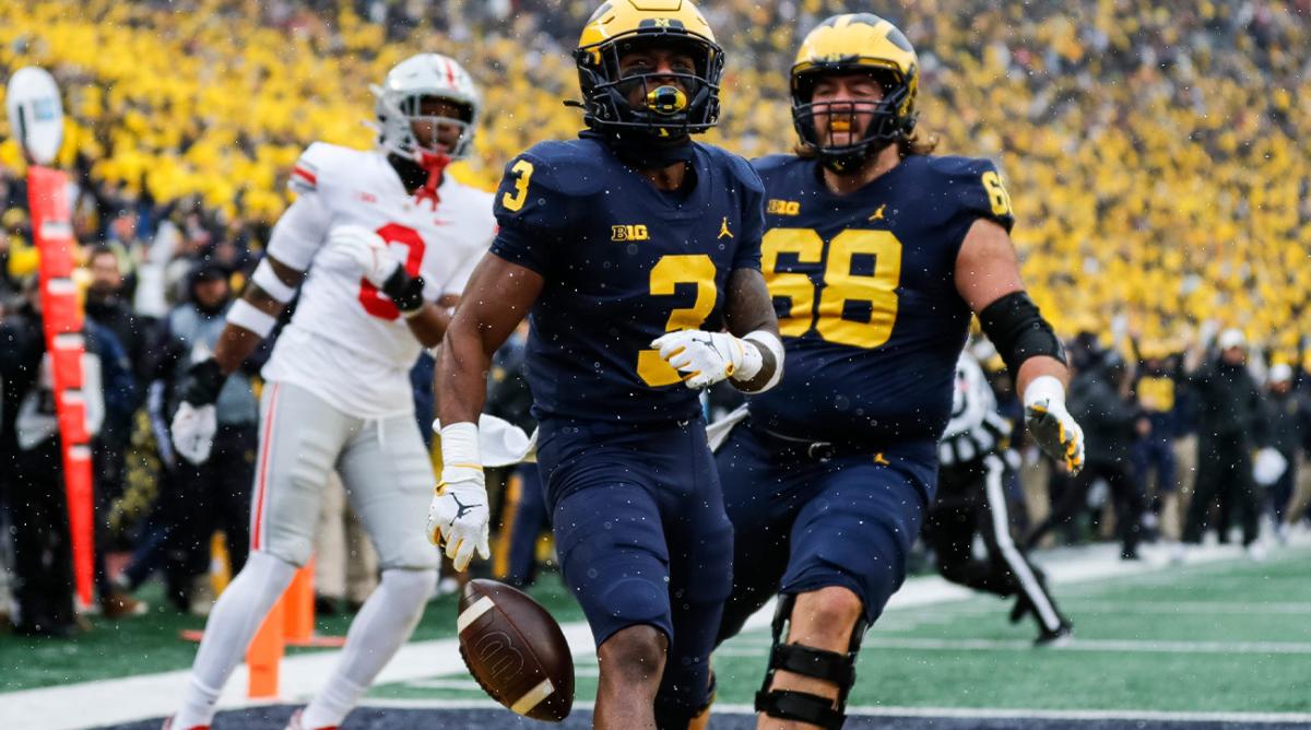 Michigan receiver A.J. Henning (3) celebrates with offensive lineman Andrew Vastardis (68) after scoring a touchdown and during the first quarter against Ohio State at Michigan Stadium in Ann Arbor on Saturday, Nov. 27, 2021. 2021-11-27-ohio-state-michigan