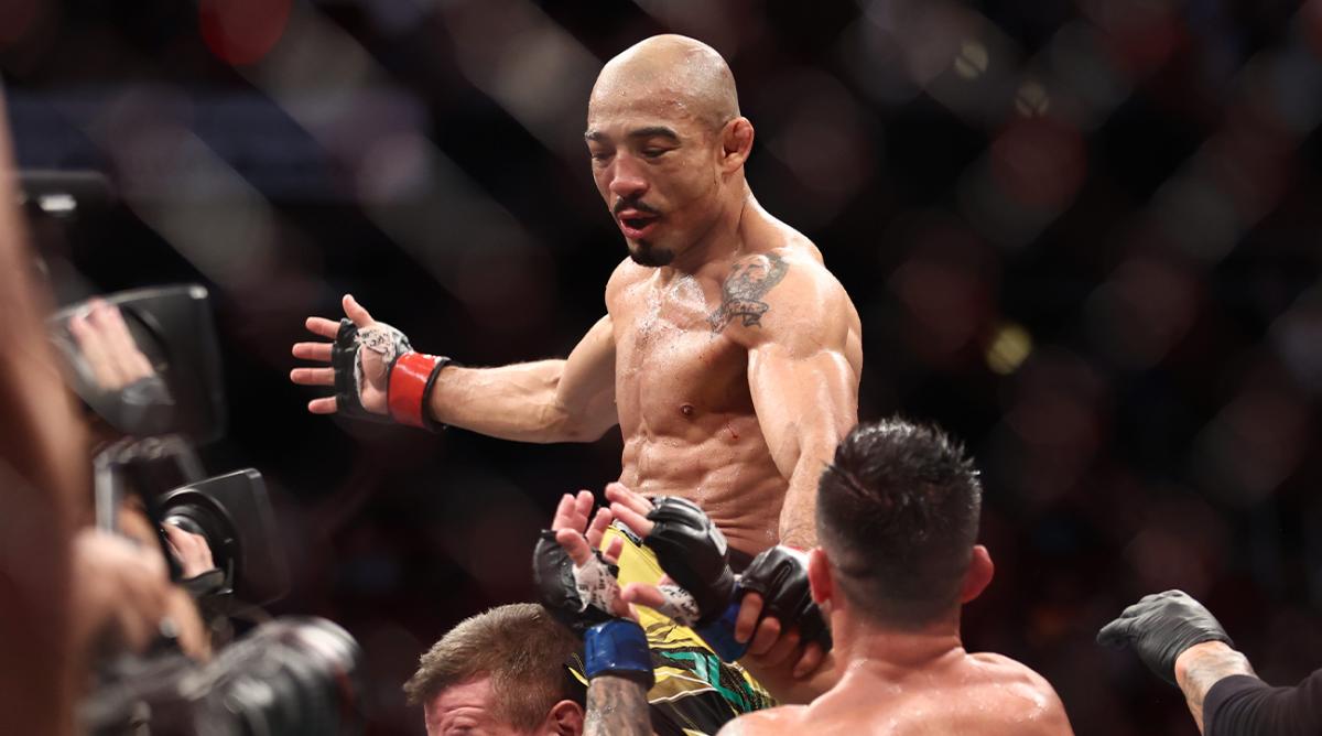 Aug 7, 2021; Houston, Texas, USA; Jose Aldo (red gloves) reacts to fight against Pedro Munhoz (blue gloves) during UFC 265 at Toyota Center. Mandatory Credit: Troy Taormina-USA TODAY Sports