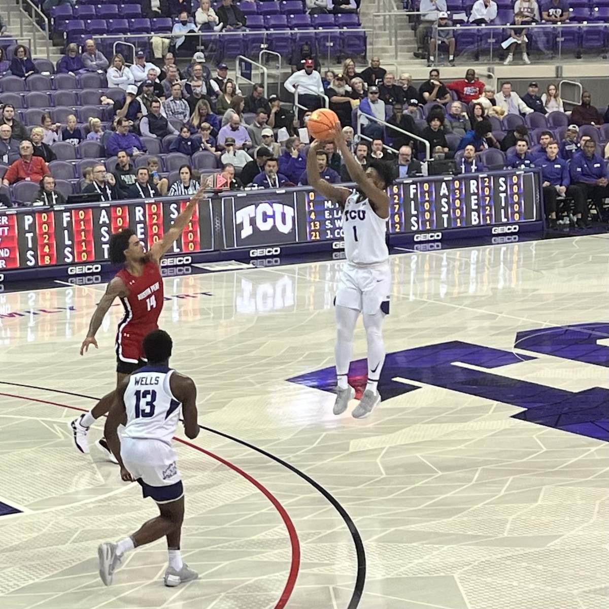 Mike Miles converts a three-point shot in TCU’s win over Austin Peay