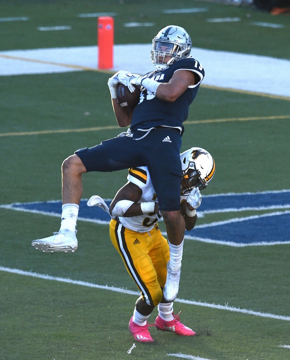 Nevada's Cole Turner catches a pass while taking on Wyoming during their football game at Mackay Stadium in Reno on Oct. 24, 2020. Ren Unr Wyo 2020 04