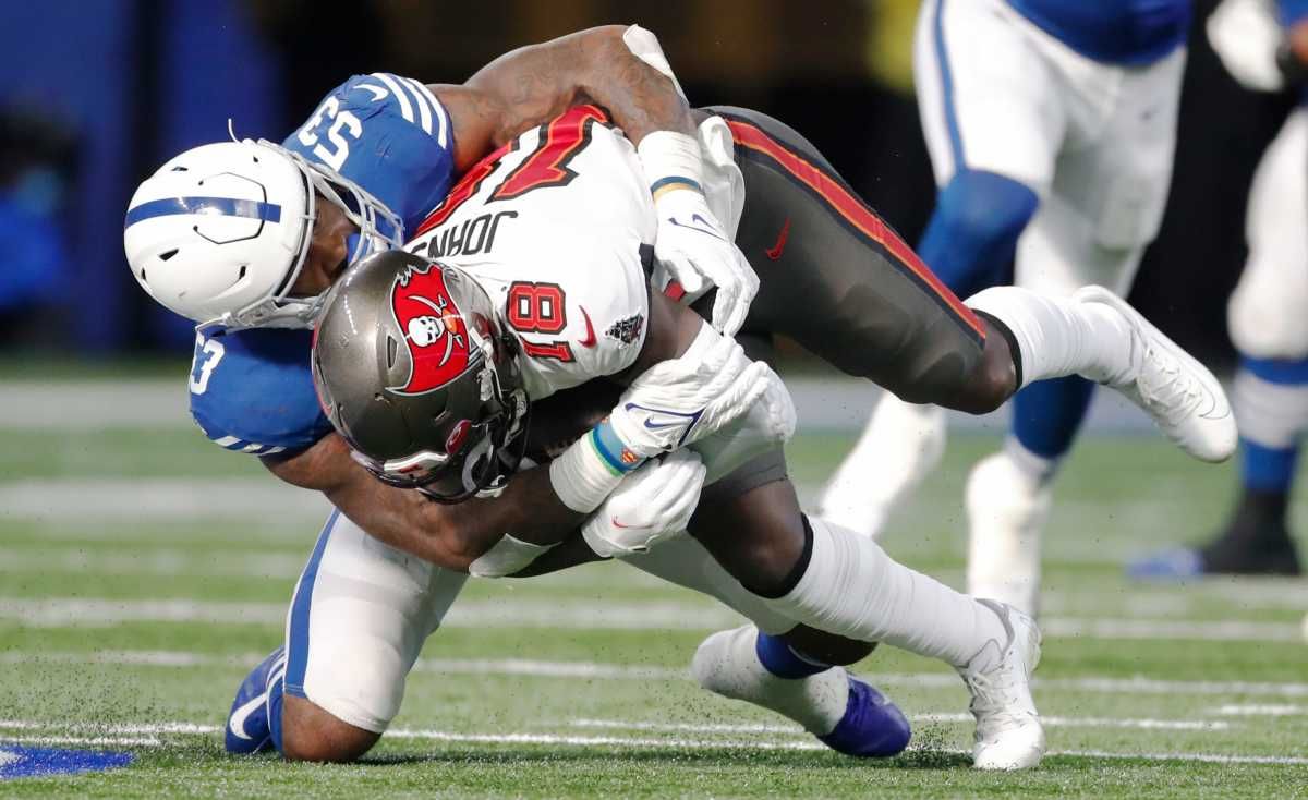 Indianapolis Colts outside linebacker Darius Leonard (53) wraps up Tampa Bay Buccaneers wide receiver Tyler Johnson (18) Sunday, Nov. 28, 2021, during a game against the Tampa Bay Buccaneers at Lucas Oil Stadium in Indianapolis.