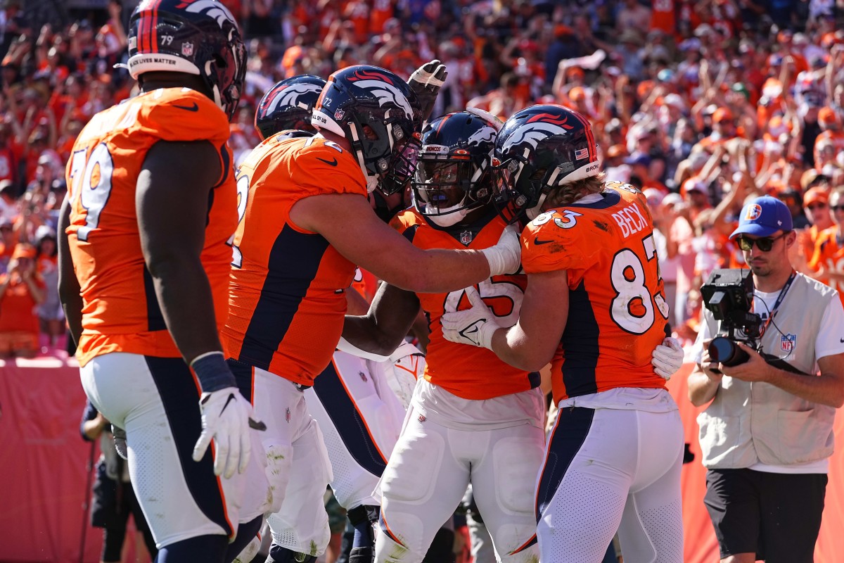 Denver Broncos running back Melvin Gordon (25) celebrates his rushing touchdown with tight end Andrew Beck (83) and offensive tackle Garett Bolles (72) in the second quarter against the New York Jets at Empower Field at Mile High.