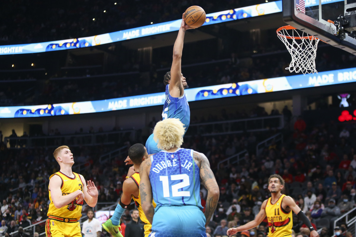 Charlotte Hornets forward P.J. Washington (25) attempts a dunk against the Atlanta Hawks in the second quarter at State Farm Arena.